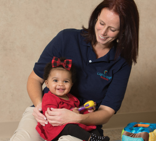 Woman holding baby in her lap